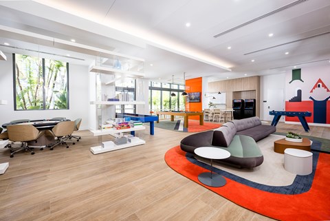 A modern living room with a large rug and a couch.