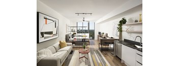A modern living room with a grey sofa and a coffee table.