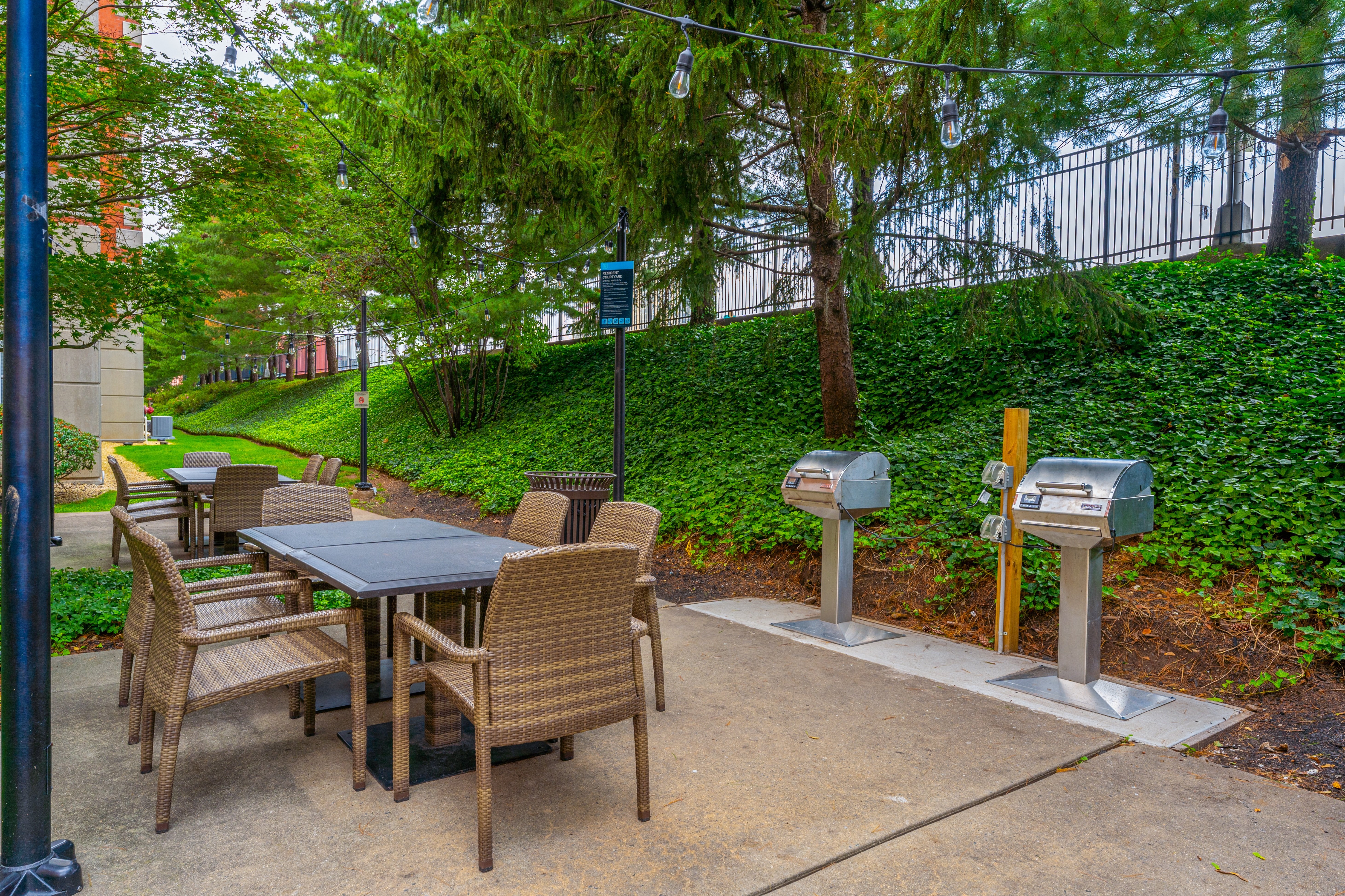 A table and chairs set up outside in a garden.