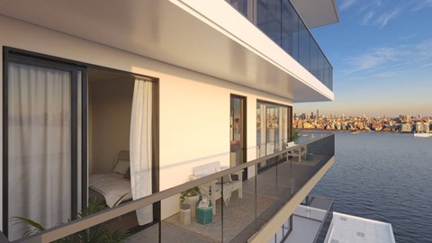 a balcony with a view of the city and the water