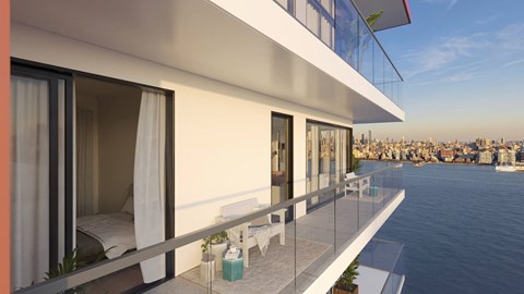 a balcony with a view of the city and the water