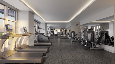 a gym with treadmills and other exercise equipment