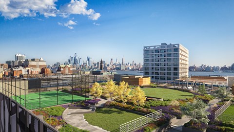 an aerial view of a park with a view of the nyc skyline