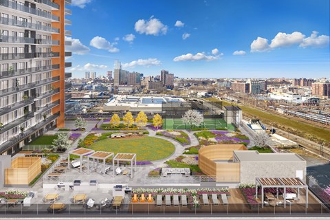 an aerial view of a park with a city in the background