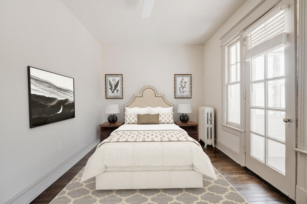 a bedroom with a bed and two windows