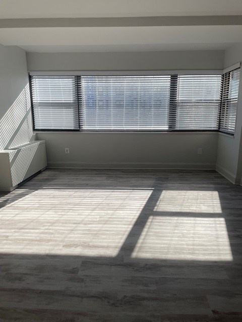 A room with a large window and a tiled floor. at 2400 Pennsylvania Avenue Apartments, Washington, DC,20037