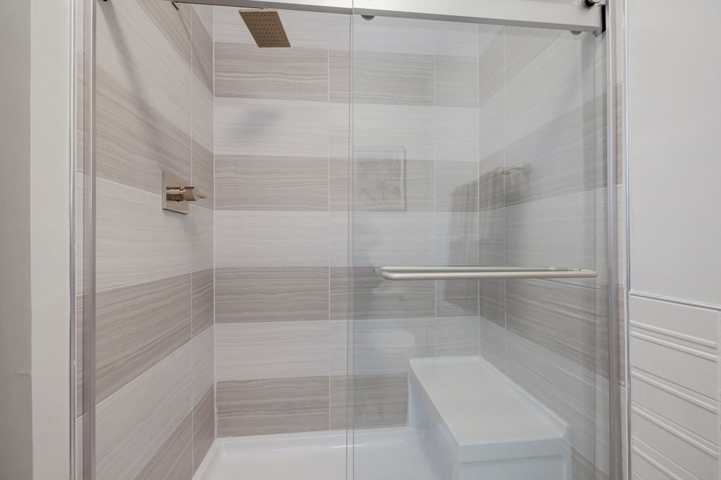 Brand new walk in shower, with bench, in select homes at Evergreens at Columbia Town Center
