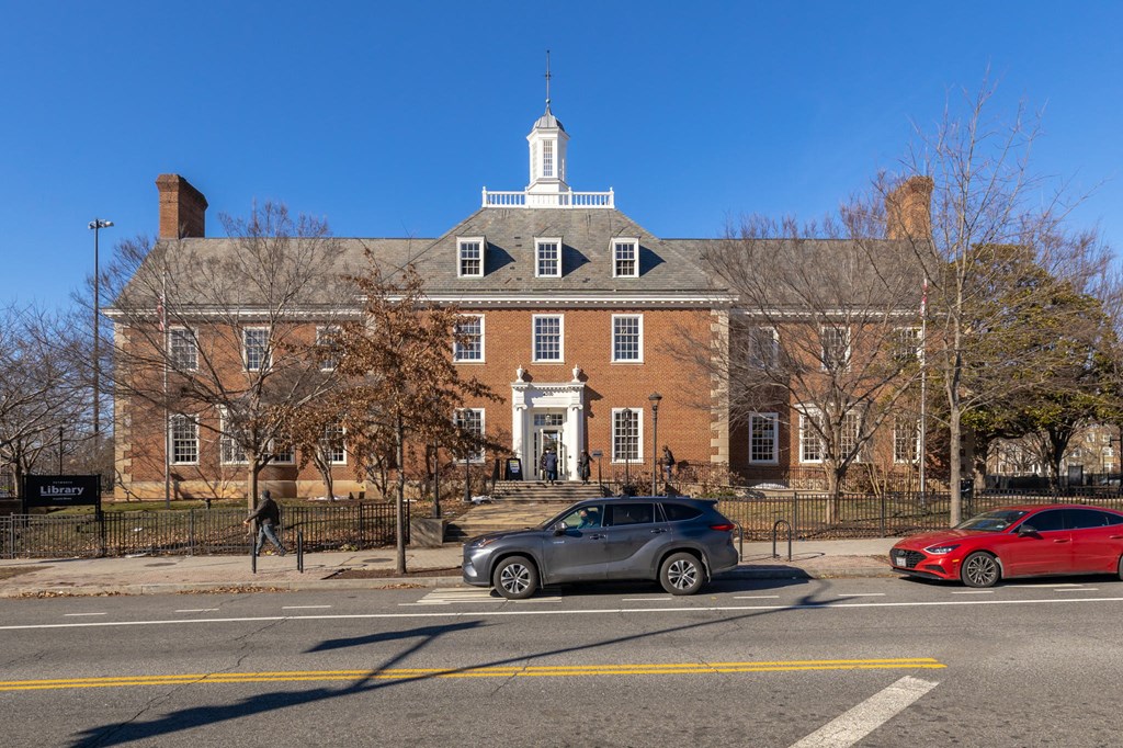 a large brick building on the side of a street