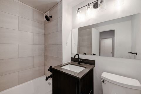 Quebec House dark renovated bathroom