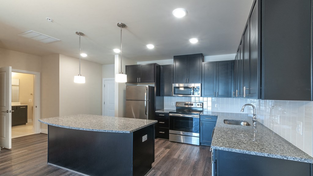 The Village at Worman's Mill kitchen dark cabinets