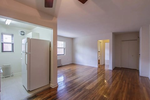 A room with wooden floors and white walls.