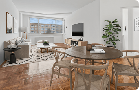 A modern living room with a wooden floor and furniture.