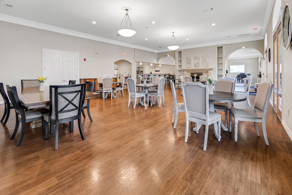a large dining room with tables and chairs