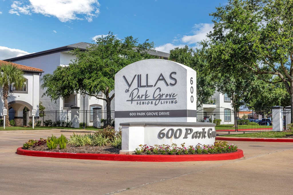 the sign at villas post grant park in good park tx