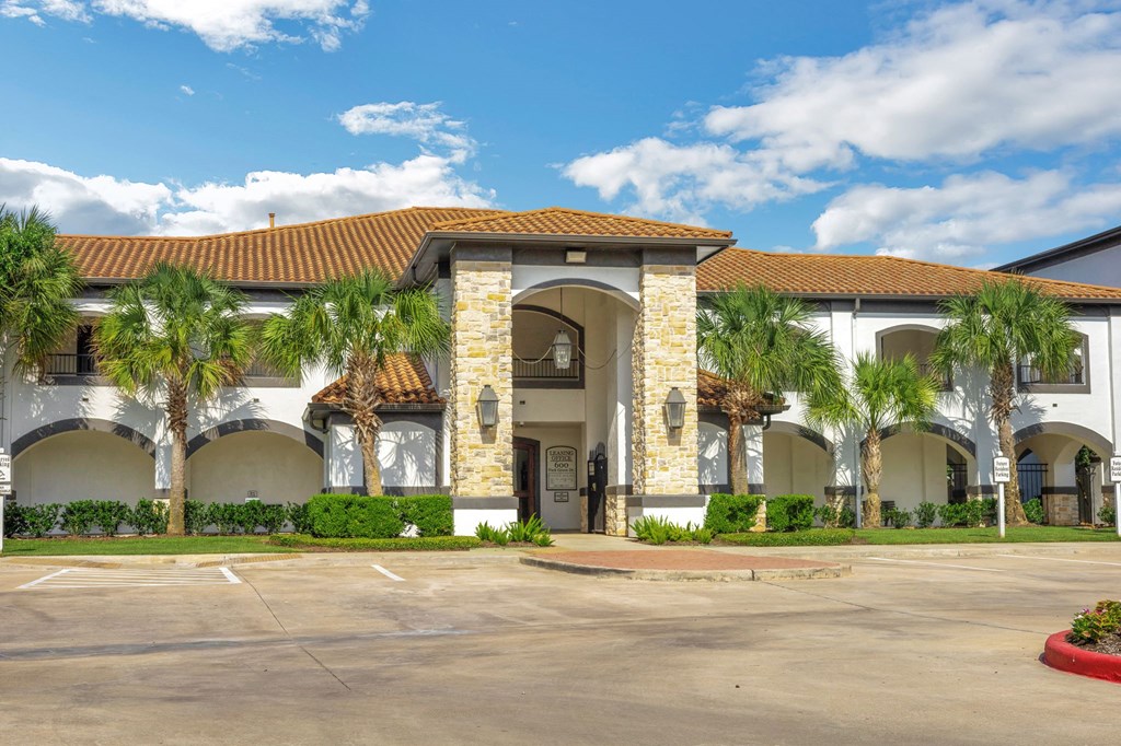 a building with palm trees in front of it