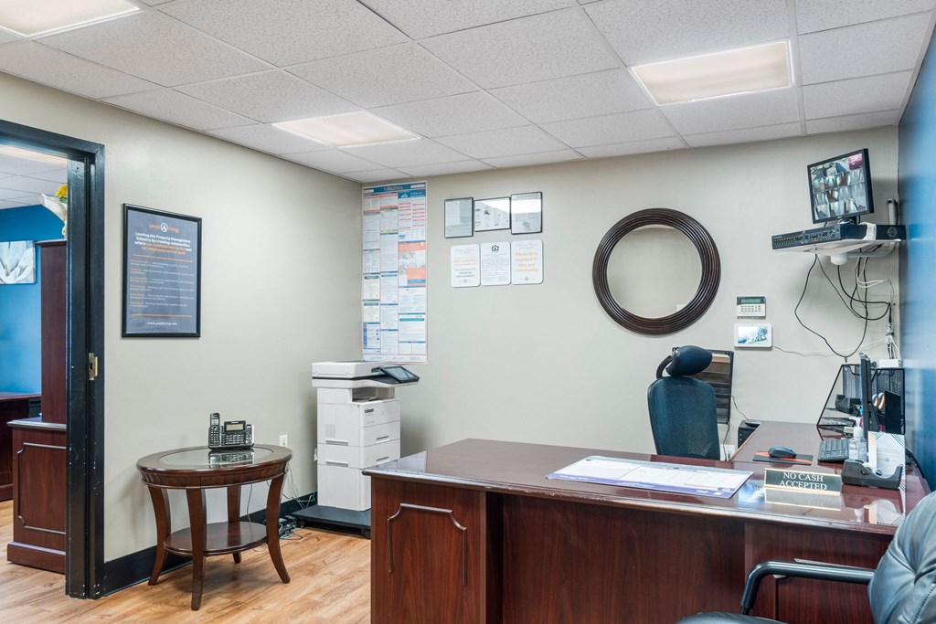 an office with a wooden desk and a chair