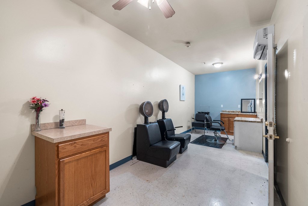 a dentist office with a chair and a counter and a exam room