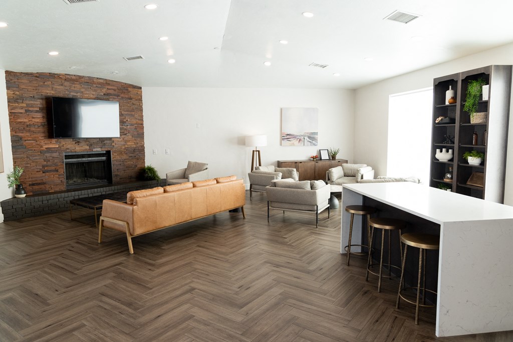 a living room with a fireplace and a table with chairs