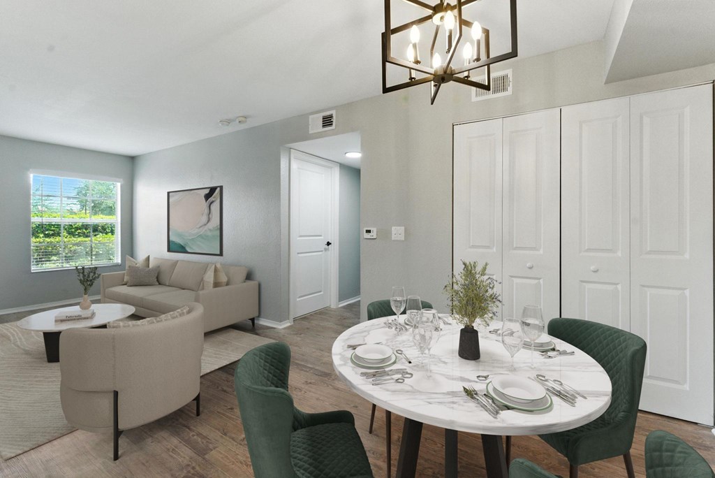 A dining room with a round table set for six.