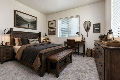 Rustic bedroom with fishing themed wall decor at Silver Ridge Apartments, Meridian, 83642