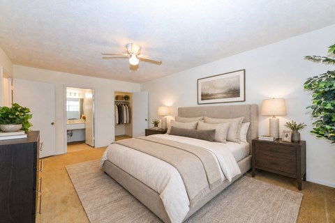 Primary bedroom with ensuite bathroom and walk-in closet at Stonetree Apartments, Georgia