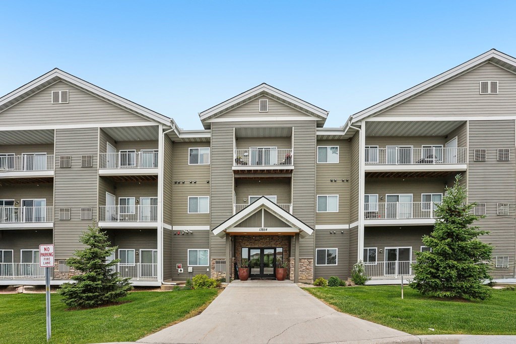 A large apartment complex with a no parking sign in front. at Lake Ridge Apartments, Prior Lake, MN