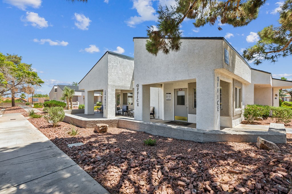 the exterior of a house with a yard and trees