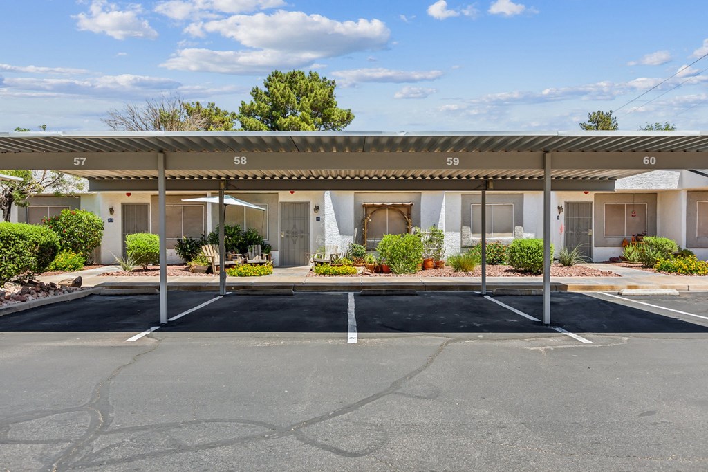 an empty parking lot in front of a motel building