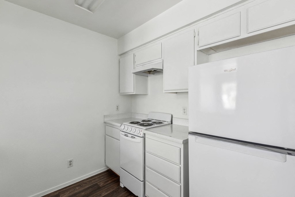 the preserve at ballantyne commons apartment kitchen with white appliances and white cabinets