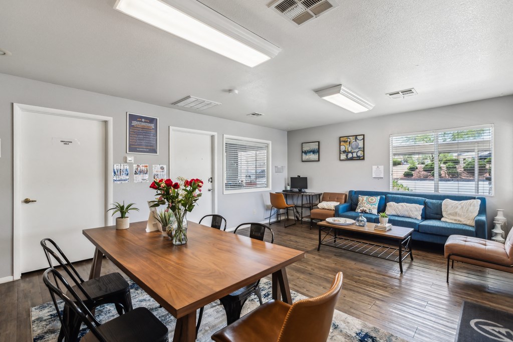 a living room with a dining room table and a couch