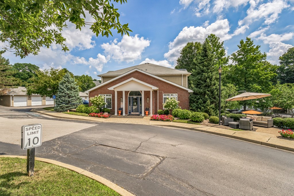 A speed limit sign of 10 is posted on the side of a road.
