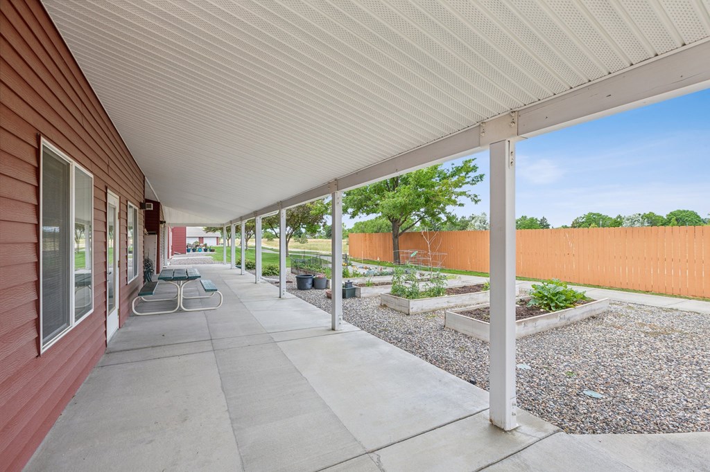 the preserve at ballantyne commons spacious covered patio with views of the community garden