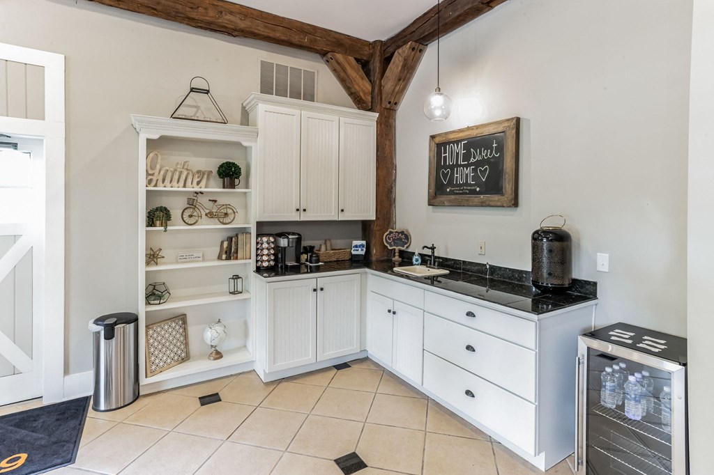 a kitchen with white cabinets and a counter top and a sink at Province of Briarcliff Apartments, Kansas City, MO, 64118