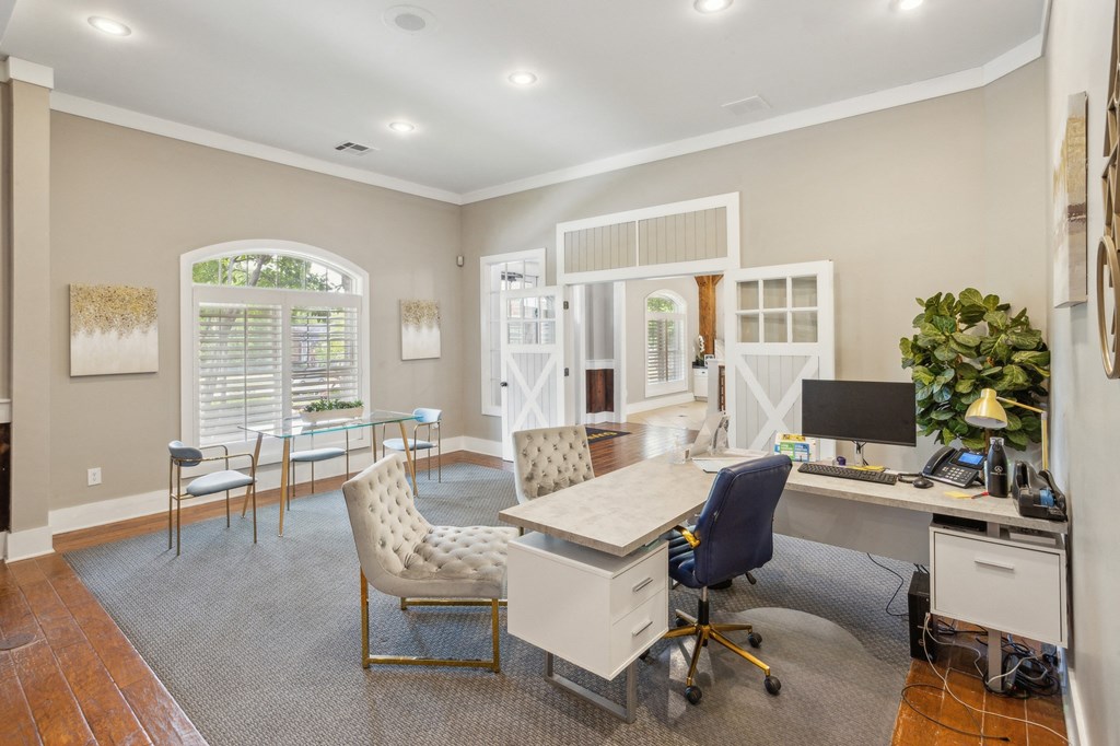 a home office with a white desk and chairs at Province of Briarcliff Apartments, Missouri