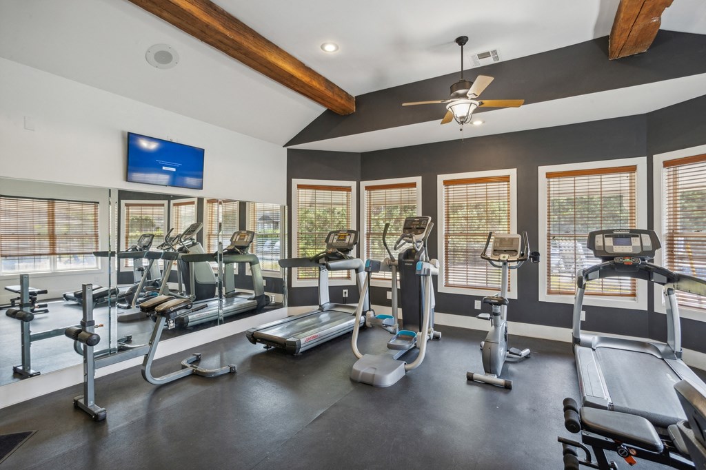 the gym with treadmills and other exercise equipment at 1861 muleshoe road at Province of Briarcliff Apartments, Kansas City
