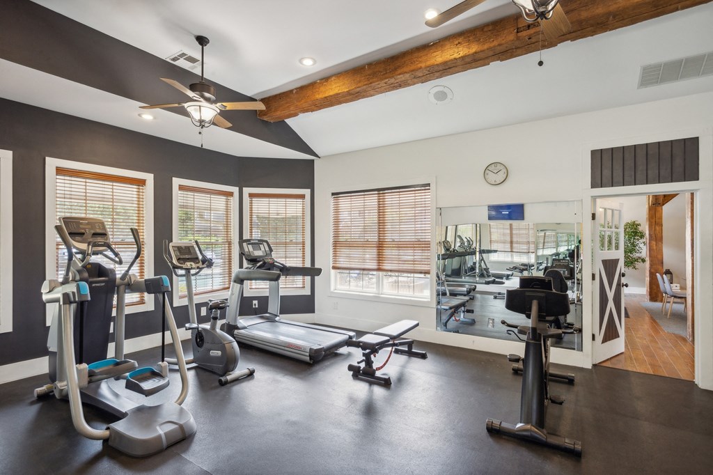 the gym with treadmills and weights at 1861 muleshoe road at Province of Briarcliff Apartments, Kansas City, 64118