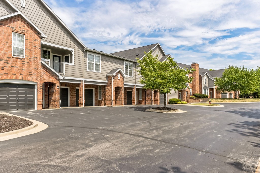 an empty parking lot in front of an apartment building at Province of Briarcliff Apartments, Kansas City, MO, 64118