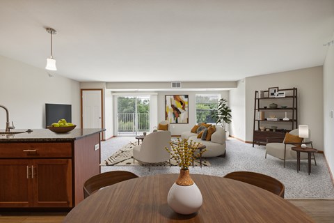A modern dining room with a wooden table and chairs.