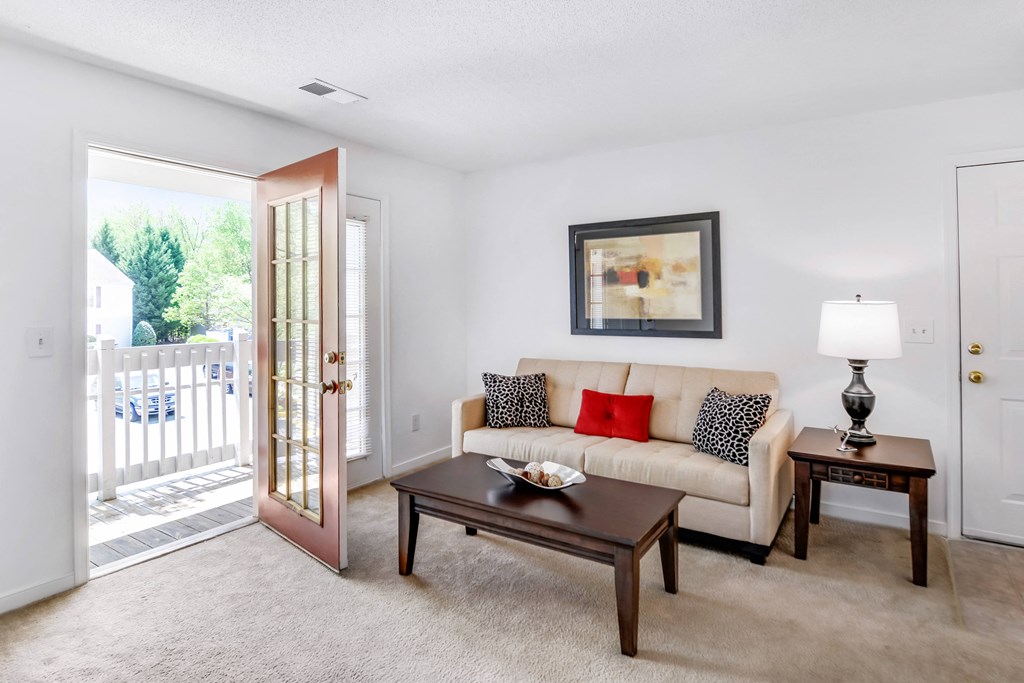 a living room with a couch and a table