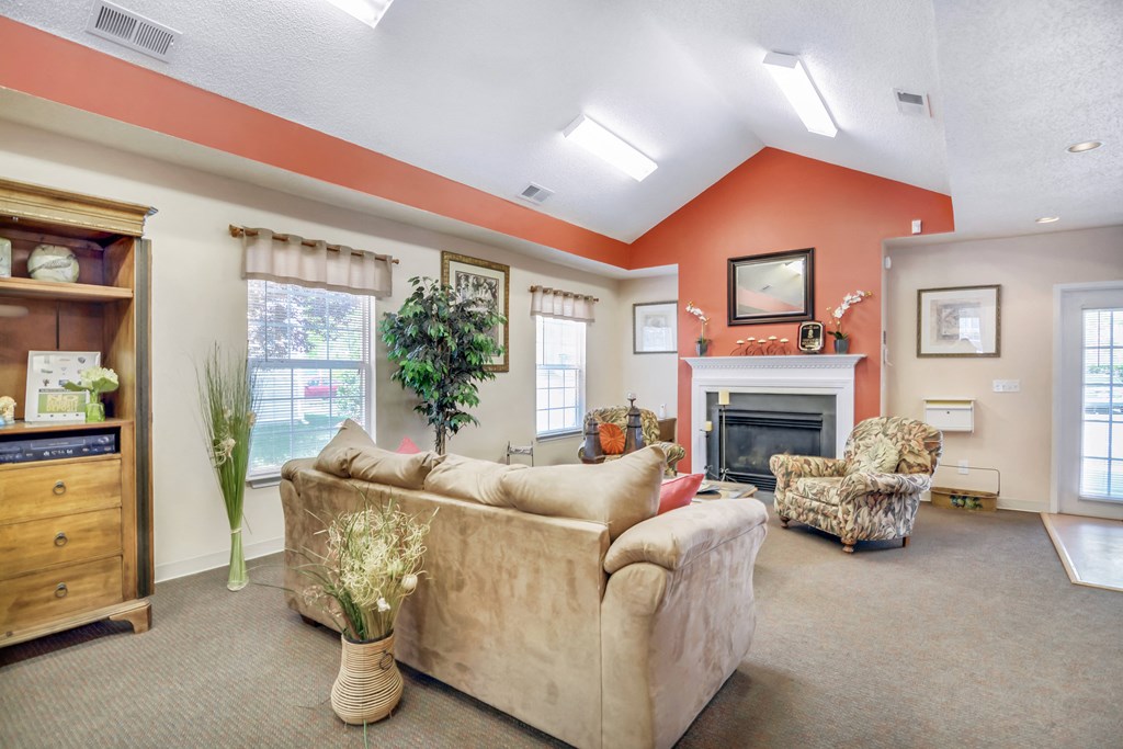 a living room with a couch and a fireplace