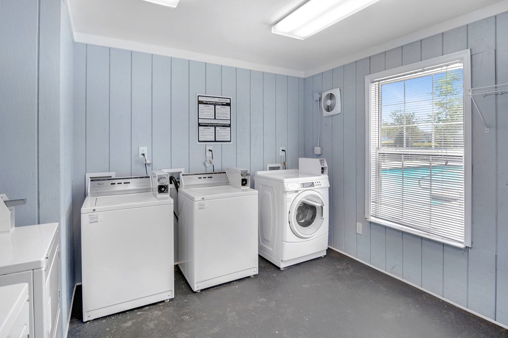 the laundry room has three washes and two dryers