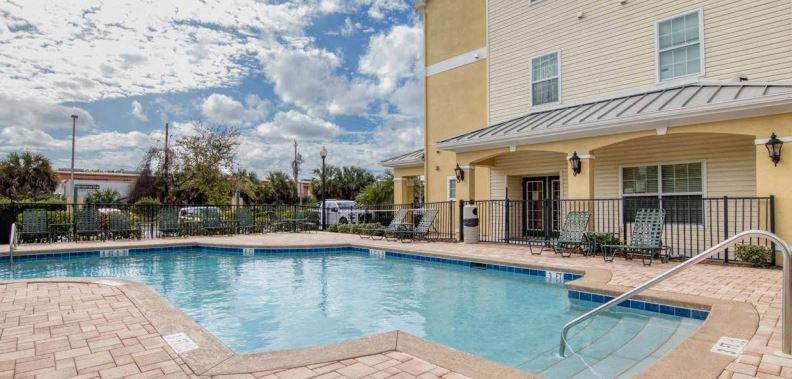 a swimming pool in front of a building