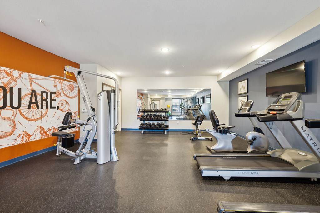 the gym with treadmills and other exercise equipment at the flats at jupiter
