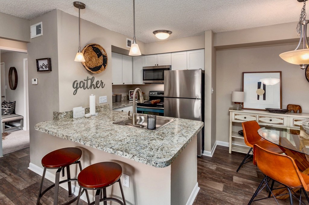 a kitchen with stainless steel appliances and a counter top