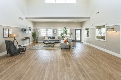 a living room with a hard wood floor and a couch