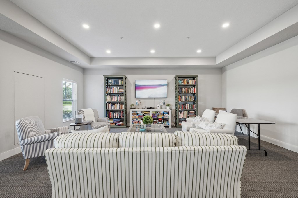 a living room with a couch and chairs and a table at The Hendrickson, Falcon Heights, 55113