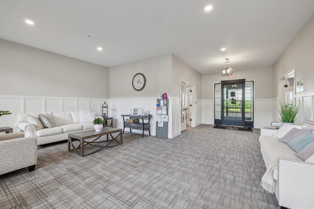 a living room with couches and a coffee table at The Hendrickson, Falcon Heights, 55113