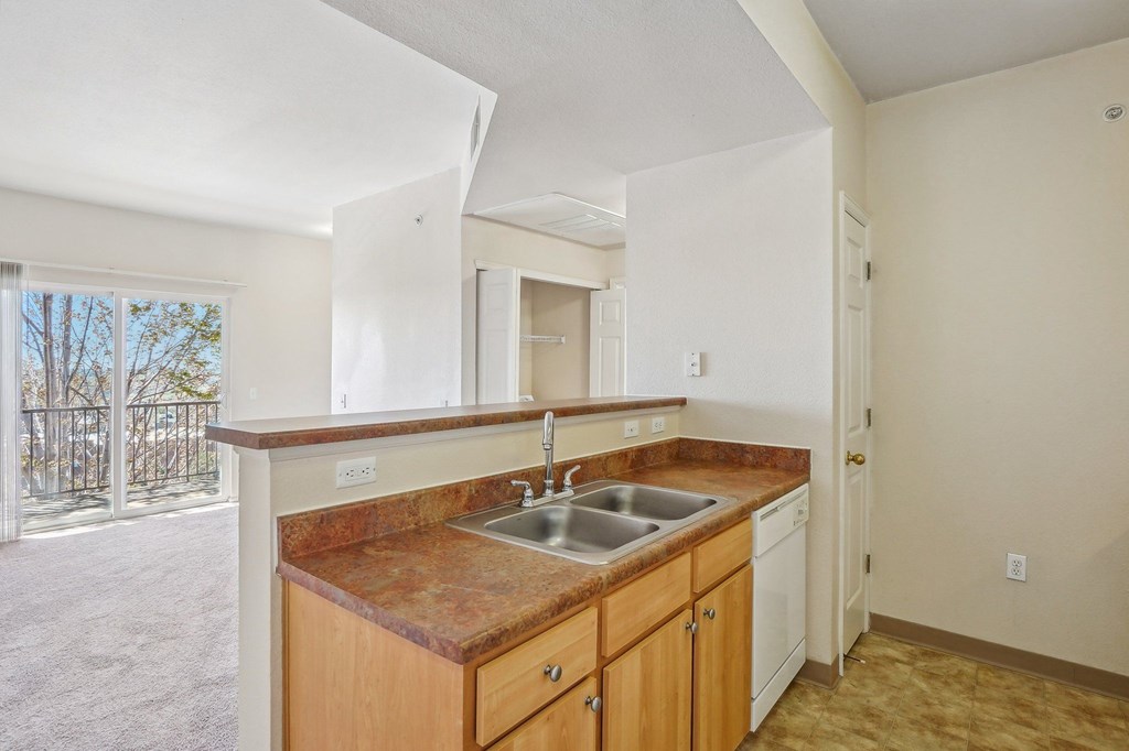 A kitchen with a brown counter top and white cabinets. at Stetson Meadows Apartments, Colorado Springs, CO, 80922