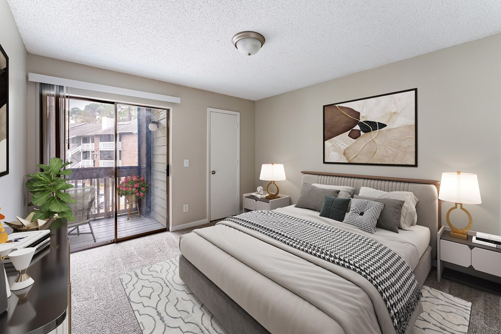 A bedroom with a large bed and a painting on the wall.