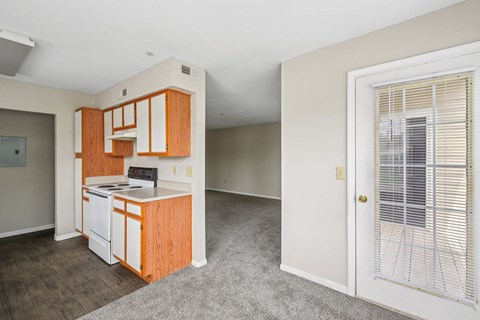 A kitchen with wooden cabinets and a white dishwasher.